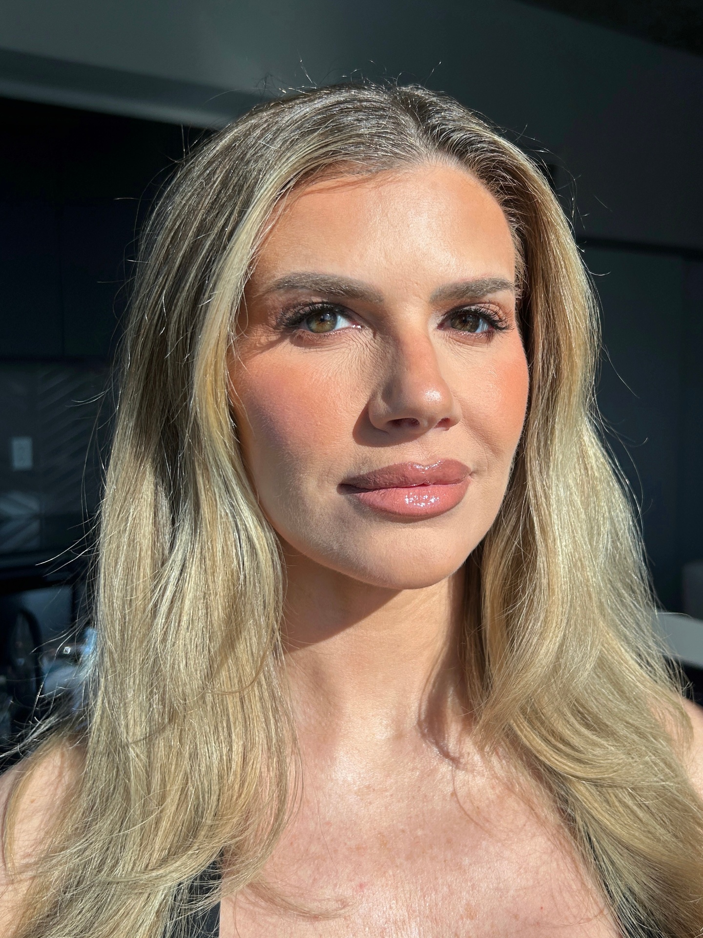 Sunlit polished glam with softly defined eyes and glossy nude lips