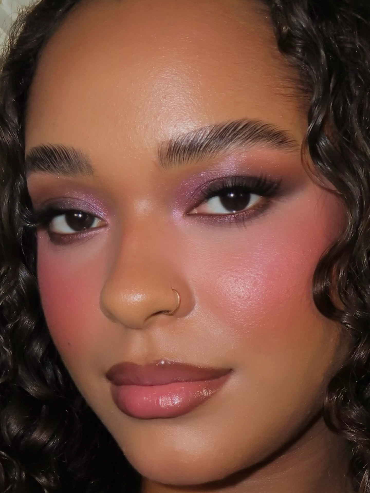 Rachel’s Signature glam with purple-pink shimmer eyes and glossy lips
