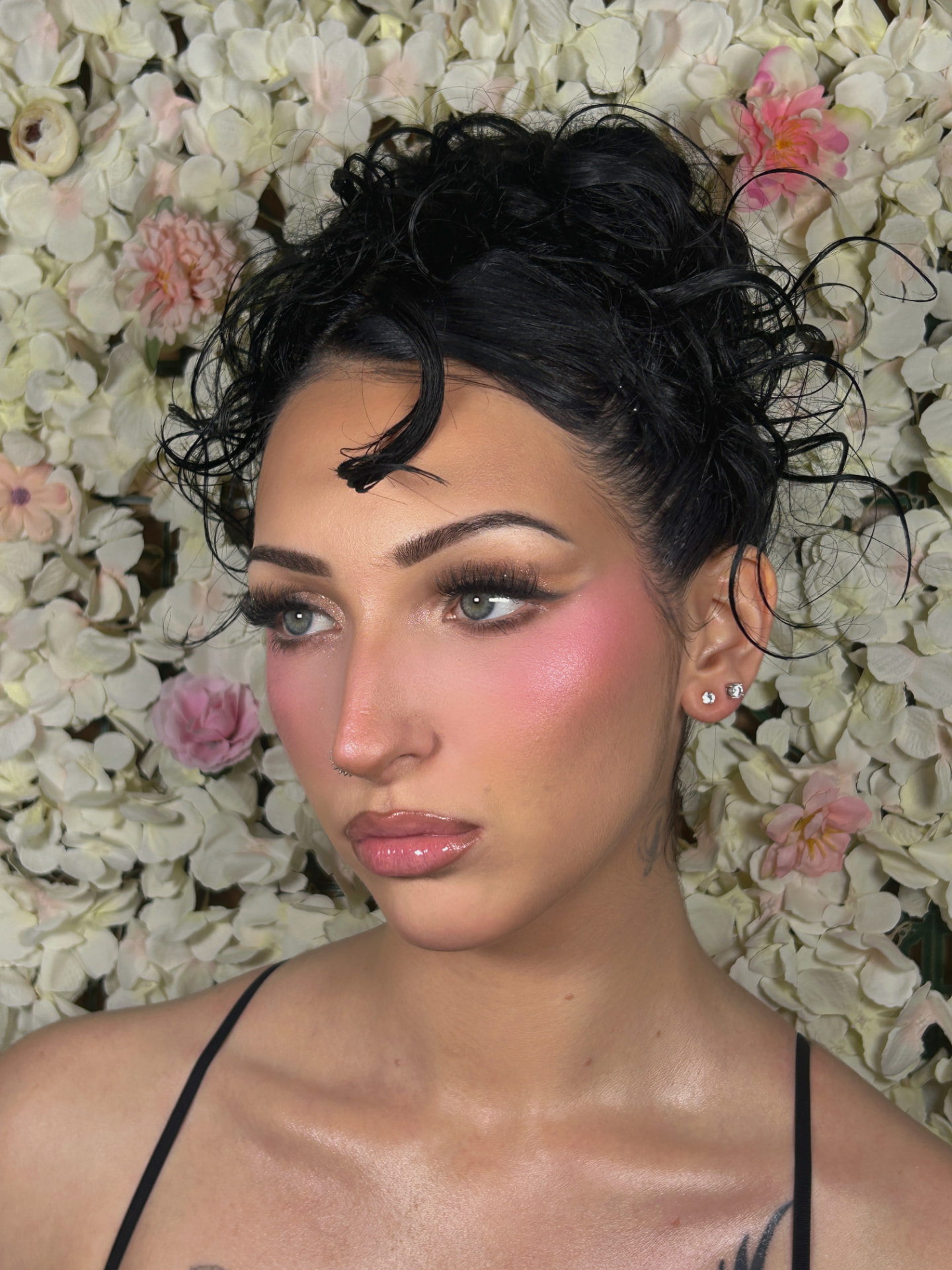Birthday glam with an elegant updo and rosy makeup